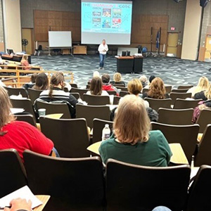CWE instructor presenting training in lecture hall