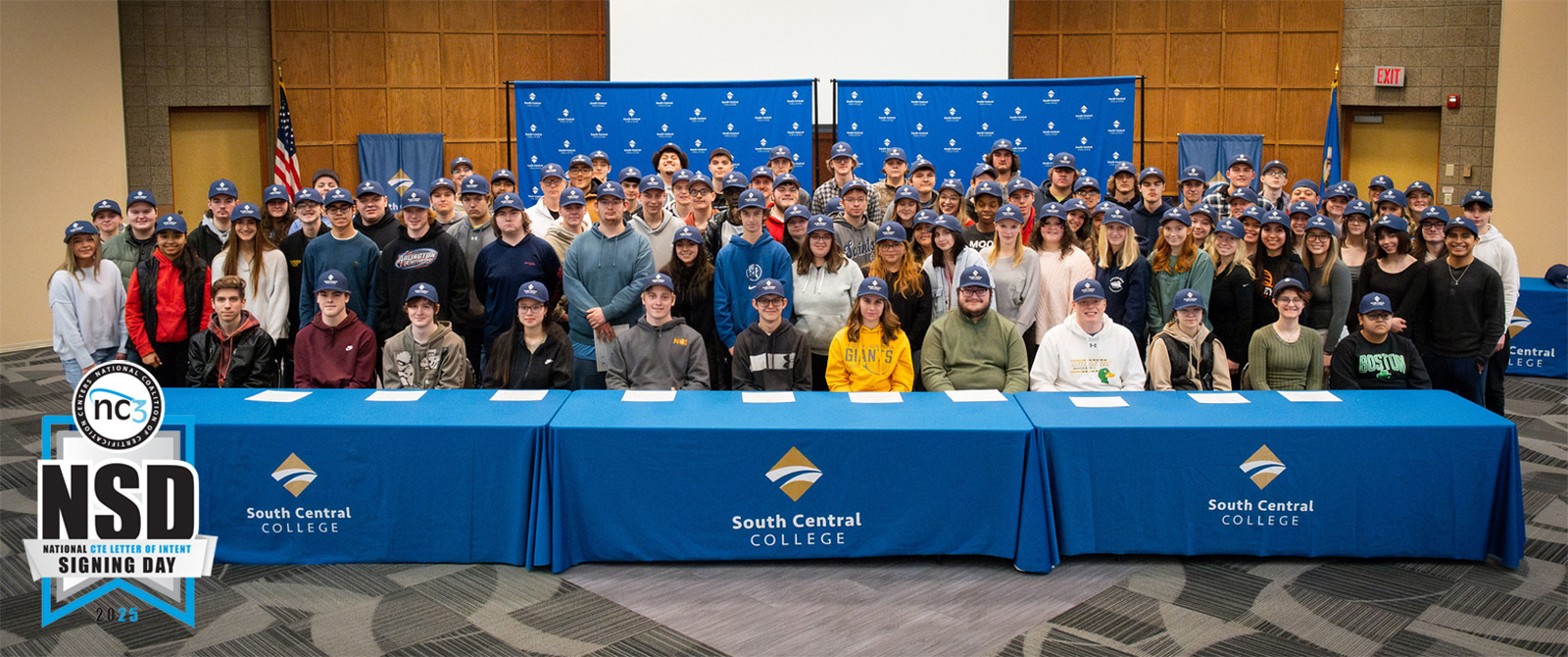 2024 Signing Day Students standing in a large group at SCC's Conference Center.