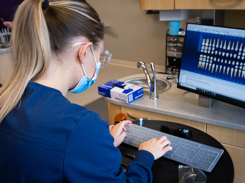 Dental Assisting student viewing x-rays on computer