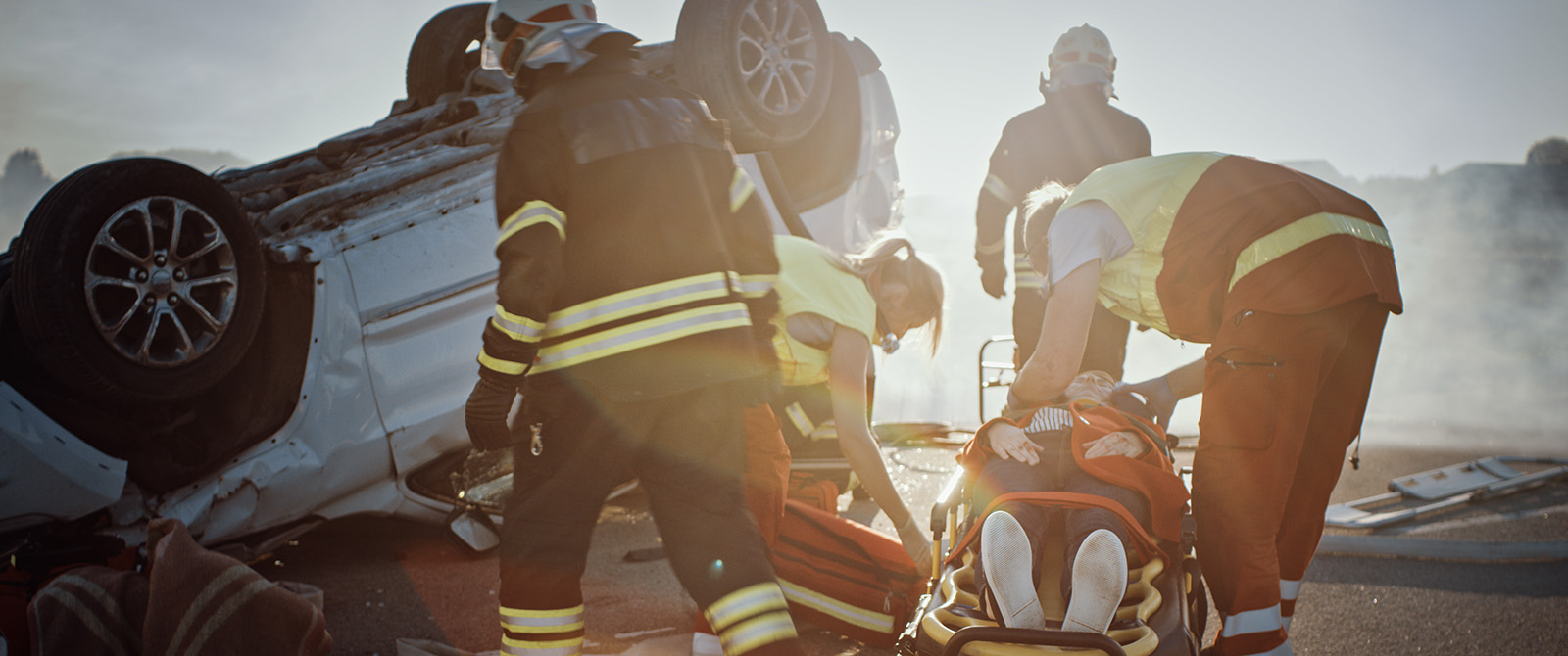 Emergency Medical Responders helping a victim at the scene of a car crash