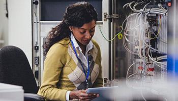Woman working on a computer network system