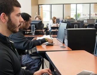 Photo of students using computers in lab