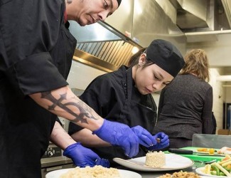 Photo of SCC culinary students working in kitchen