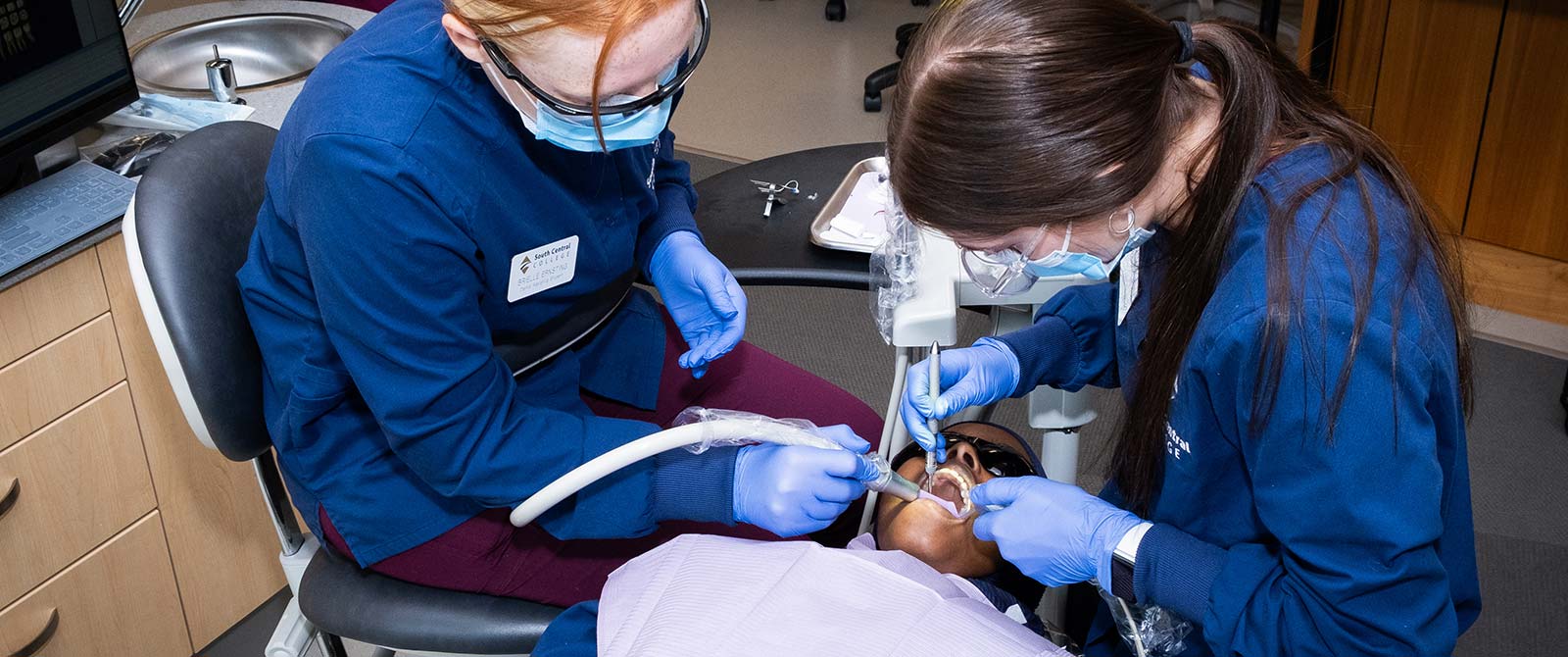 Dental Assisting students working on a patient