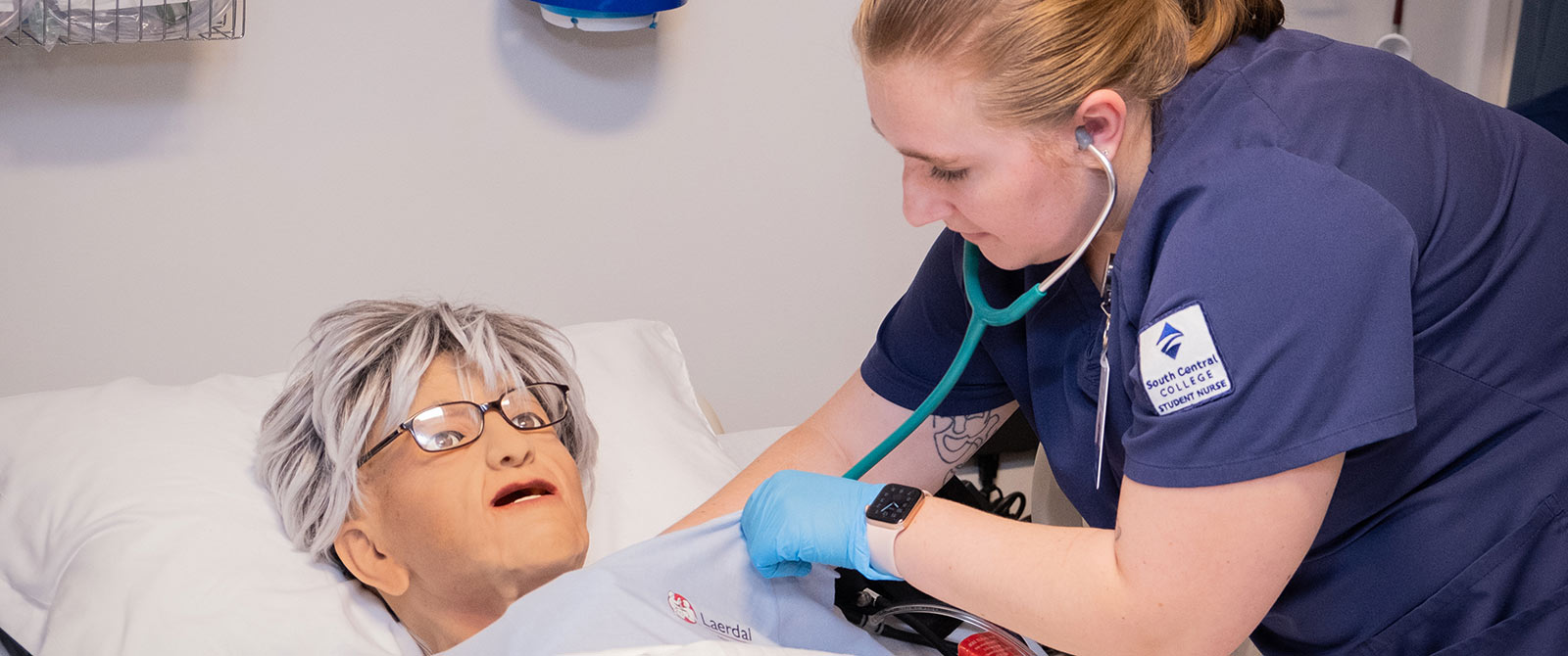 Student working on a patient simulator